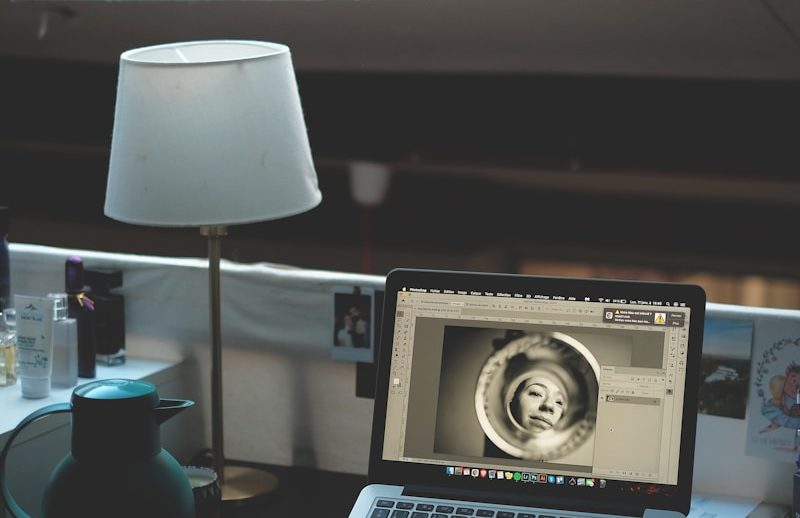 macbook pro on brown wooden table